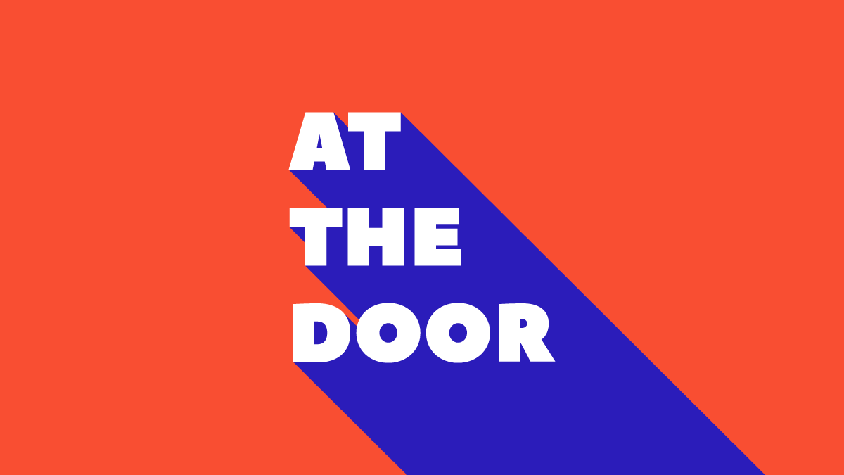 Animation still with text reading "At the door" on a red background. The front letters of the text are white, and they extrude into a 3D space towards the bottom right. The extruded sides and bottom of the letters are blue.