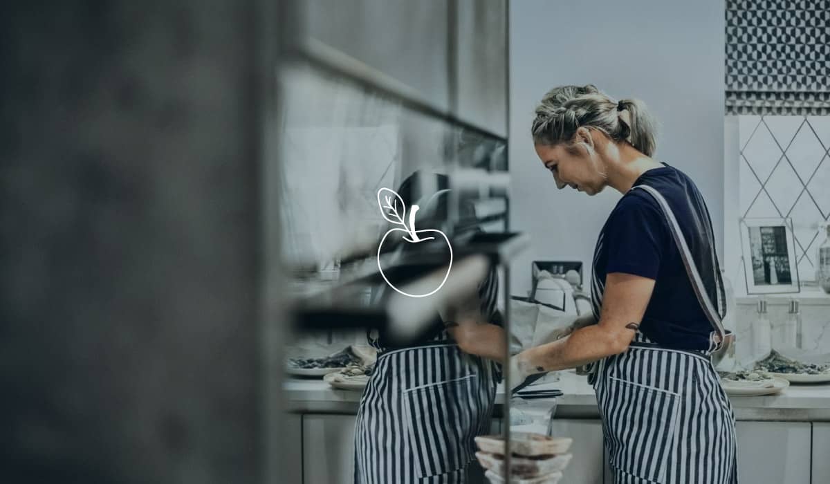The founder of Black Butter in her kitchen preparing high end , wholesome food.