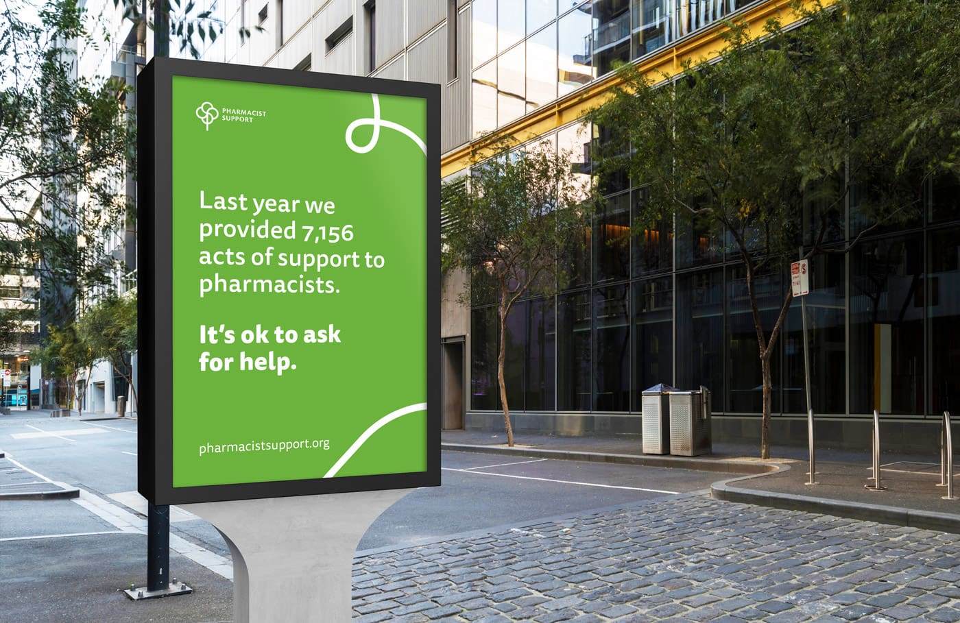 Brand awareness poster, the text reads: “Last year we provided 7,156 acts of support to pharmacists. It’s okay to ask for help”.