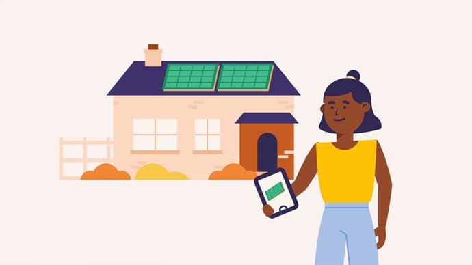 A lady outside of her house holding an iPad which controls the energy in her home. Her house has solar panels on the roof.