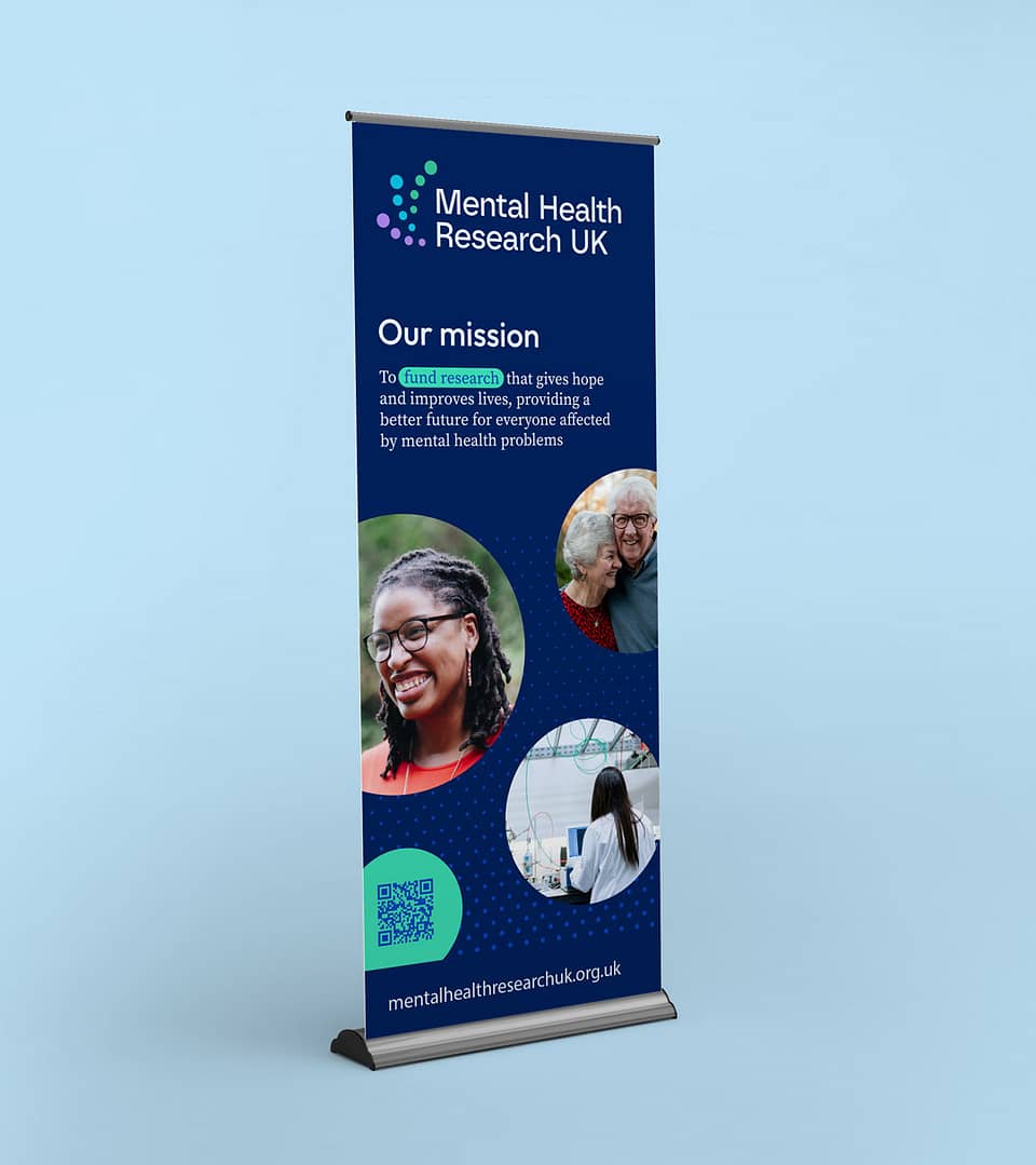 A promotional pop-up banner for Mental Health Research UK. It features the charity's mission "To fund research that gives hope and improves lives, providing a better future for everyone affected by mental health problems," set against a deep blue background. The banner displays images of diverse individuals, representing the wide range of people the organisation aims to support. A QR code and the website address, mentalhealthresearchuk.org.uk, are included for more information.